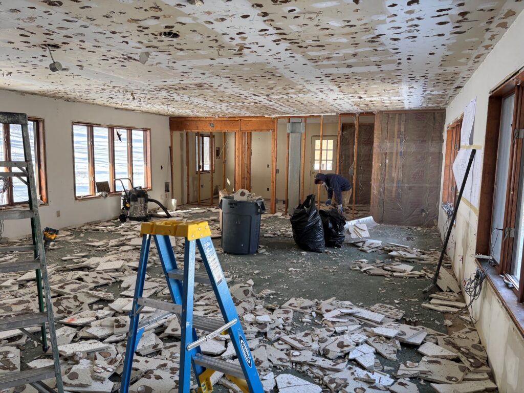 Interior of a room with construction debris covering the floor