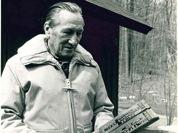 Image of man, Jim Gibb, in front of the Mianus River Gorge Office. 