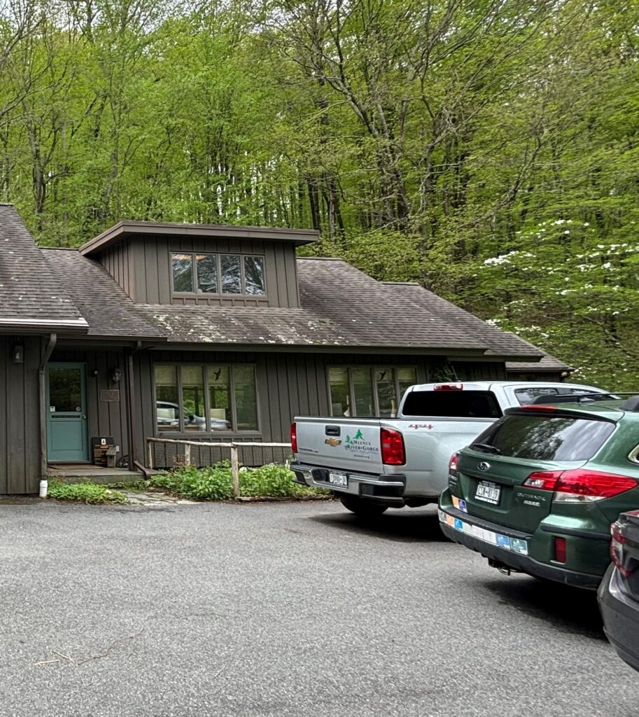 Outside of the old Mianus River Gorge Office, a brown building 